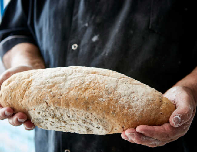 Sam holding bread